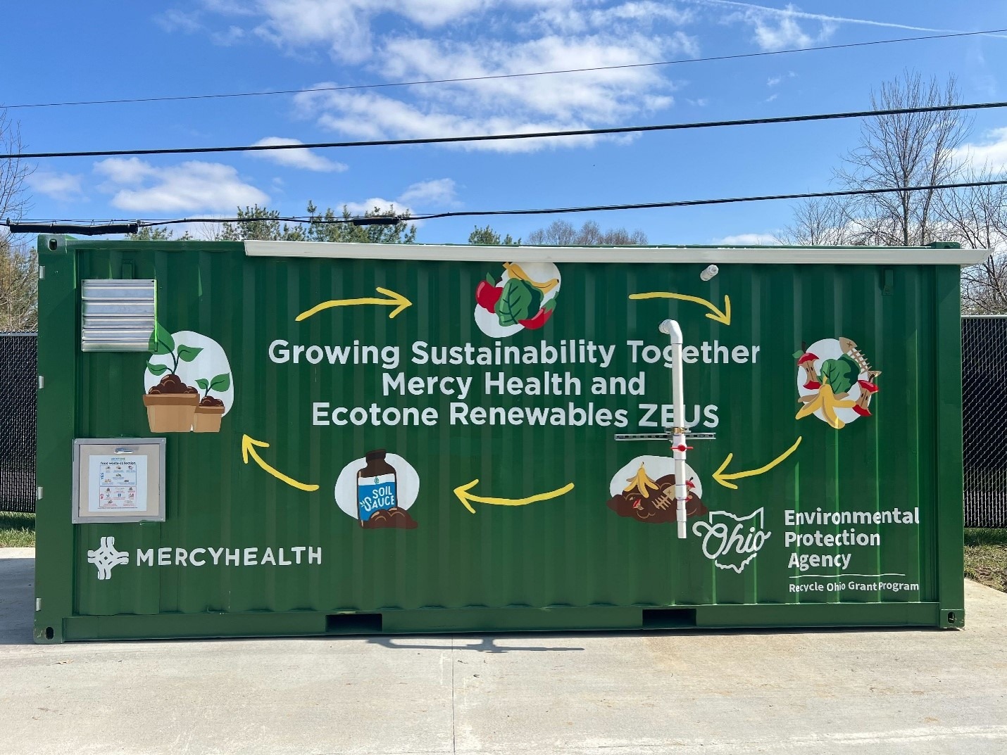 ASHE Dumpster dumpster that reads Growing Sustainability Together Mercy Health and Ecotone Renewables