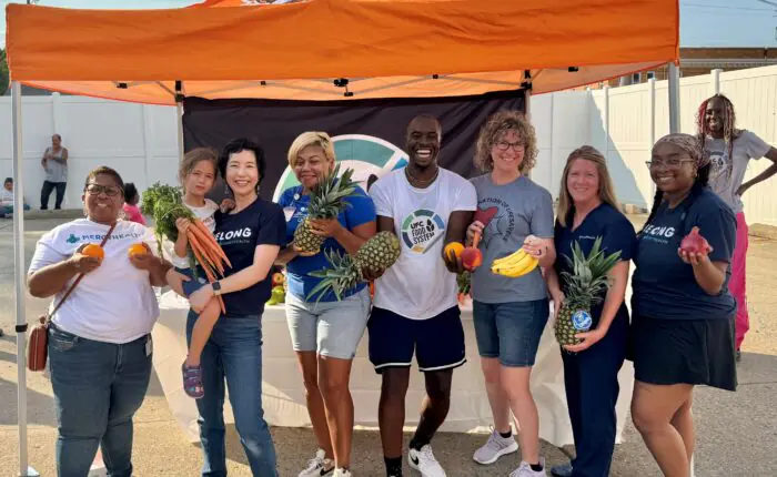 Cincinnati_Food group of Bon Secours Mercy Health employees holding fresh fruits and vegetables